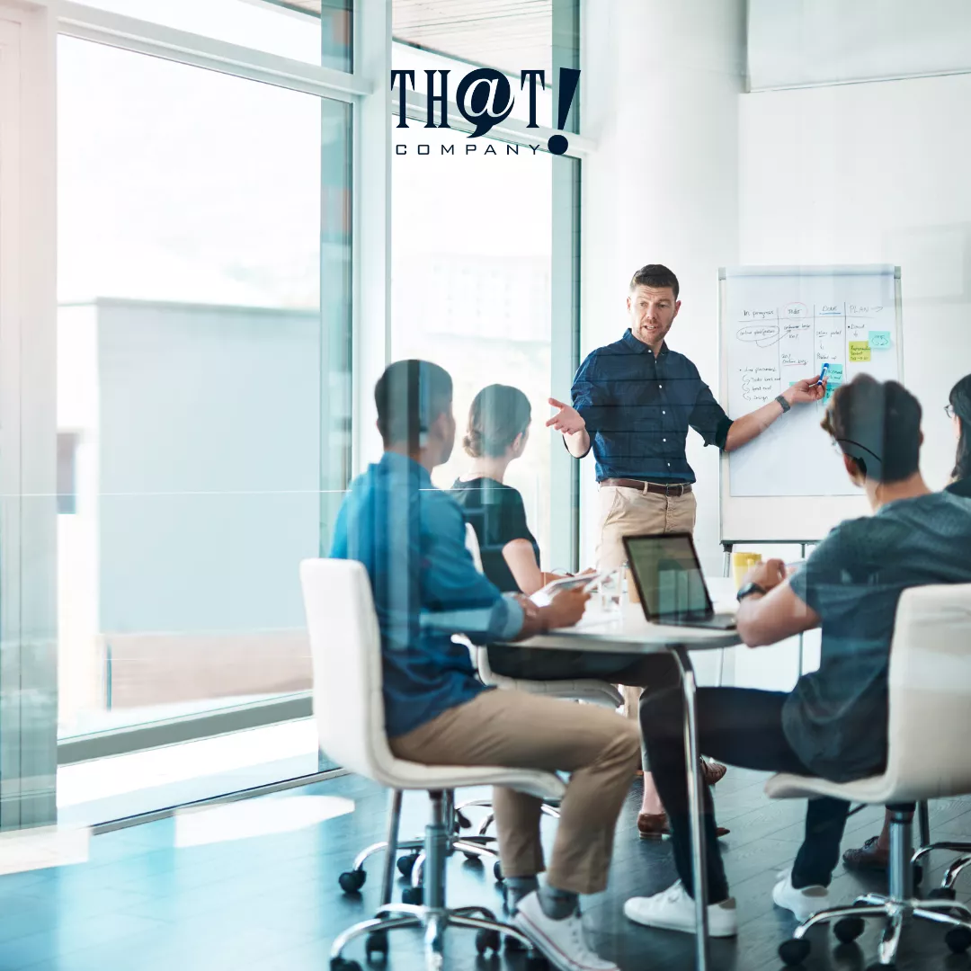 About That Company | Group Of People Having A Meeting in A Conference Room